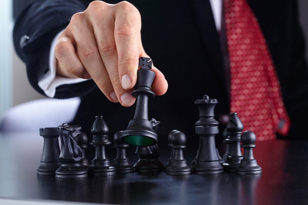 businessman playing chess game