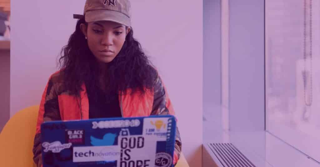 woman coding on a laptop